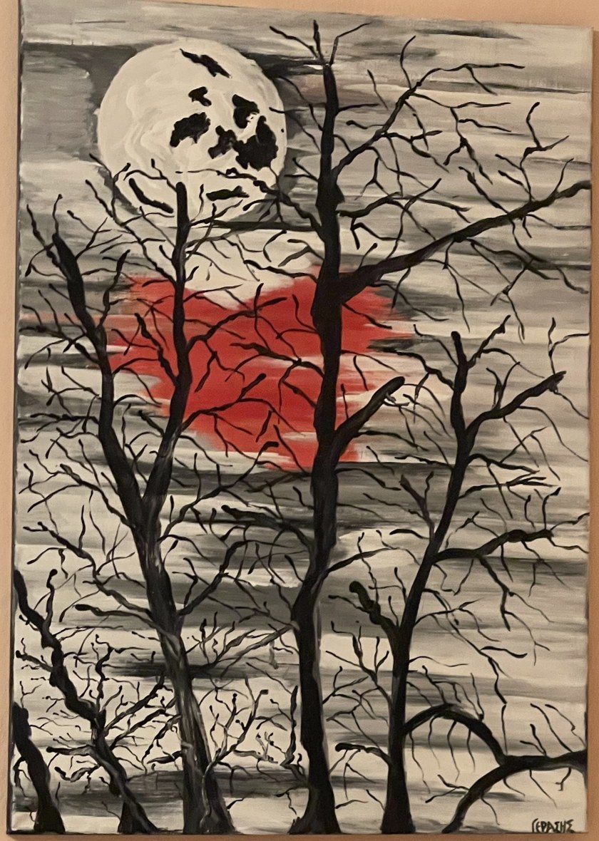 Red Moon Through Branches